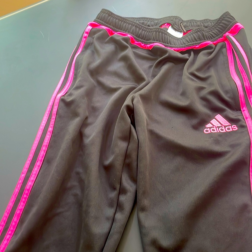 Women's xl adidas !lack athletic pants with hot pink stripes.